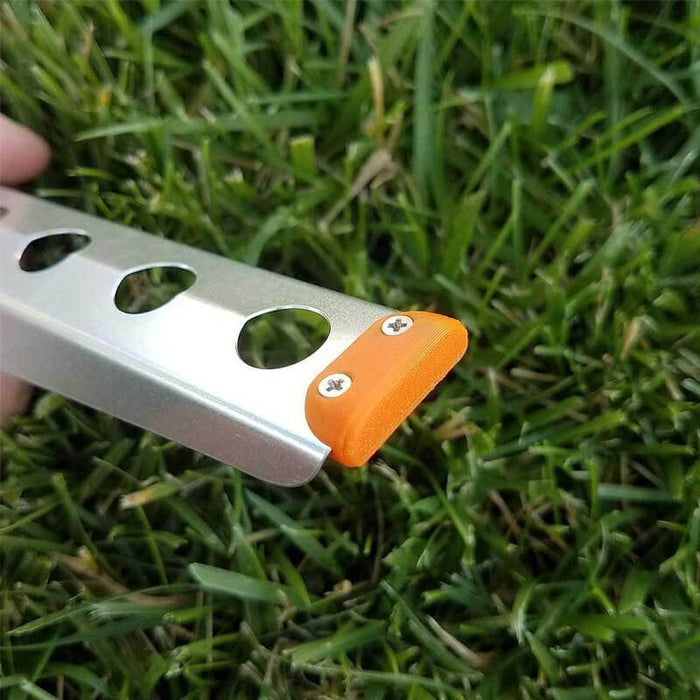 BoglerCo Ultralight Trowel angled studio view showing serrated edge and spine holes
