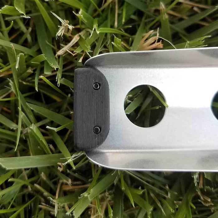 BoglerCo Ultralight Trowel on grass – spine grip holes detail