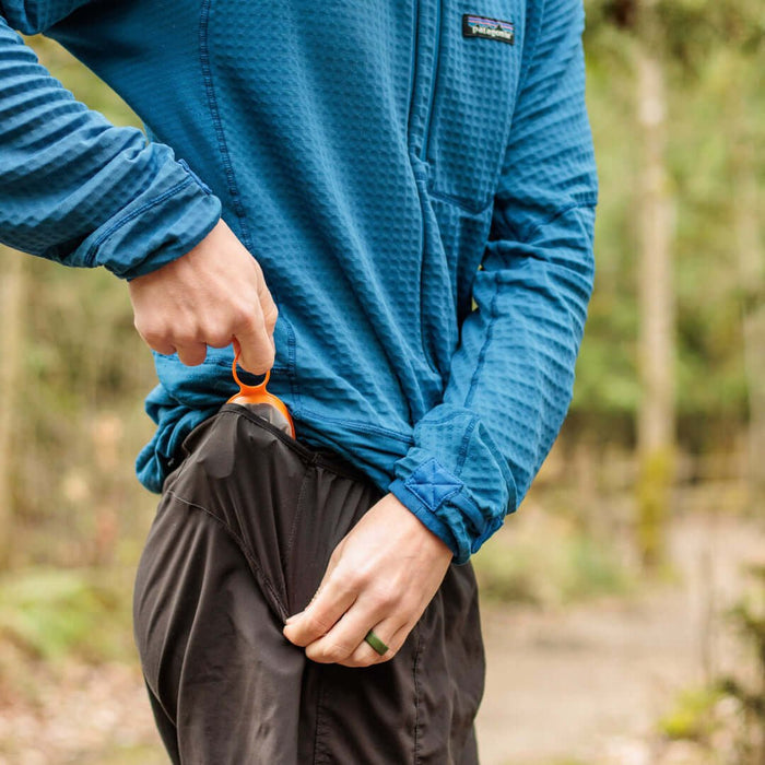 CNOC Curn Collapsible Cup clipped to a waistband