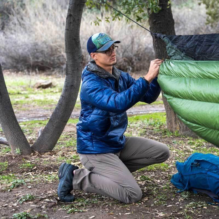 Enlightened Equipment Torrid Apex Pullover Men's worn by a person outdoors at camp
