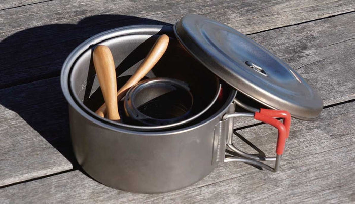EVERNEW Beech Spork S – beech utensil resting in a titanium pot outdoors