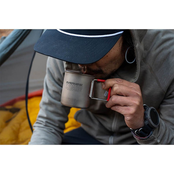 EVERNEW Ti 300FH Mug – person drinking from the mug outdoors