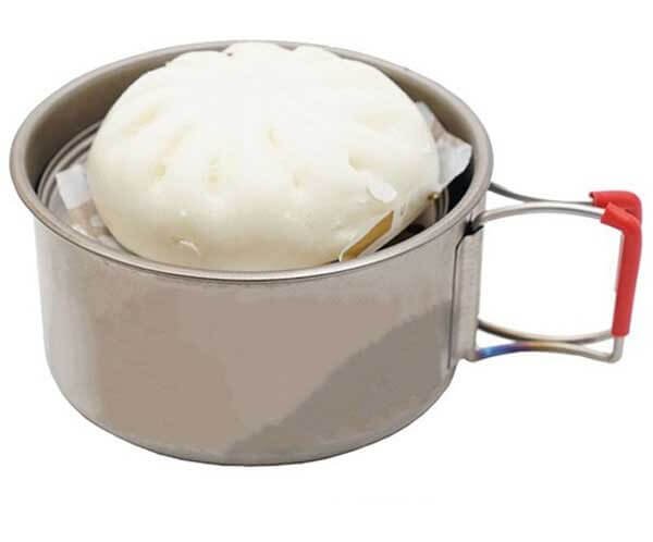 EVERNEW Ti Steam Dish – dish inside a pot steaming a bun, in use