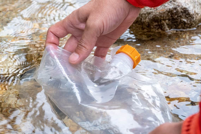 Evernew Water bag – filling the water bag from a stream outdoors