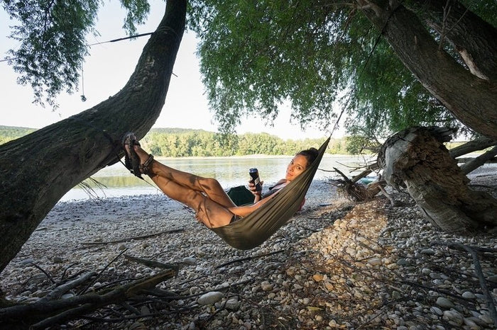 Outdoorline Gear Sling / Pack Cover / Hammock Chair – lounging in a hammock by the water
