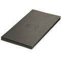 Gossamer Gear Thinlight Foam Pad 1/8" folded into a flat stack, embossed logo on top