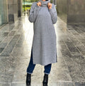 High collared ribbed open sided pullover .