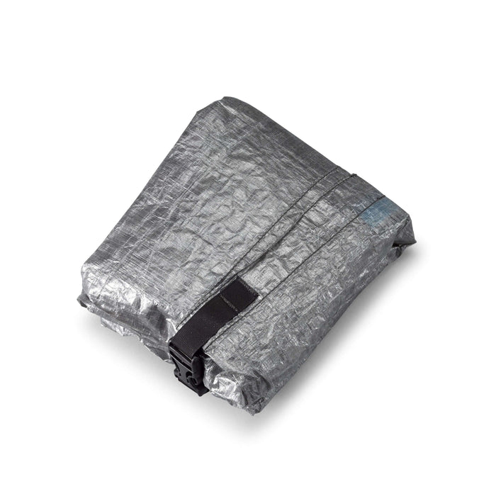 HMG Stuff Pack in grey Dyneema – side profile with shoulder strap, studio view