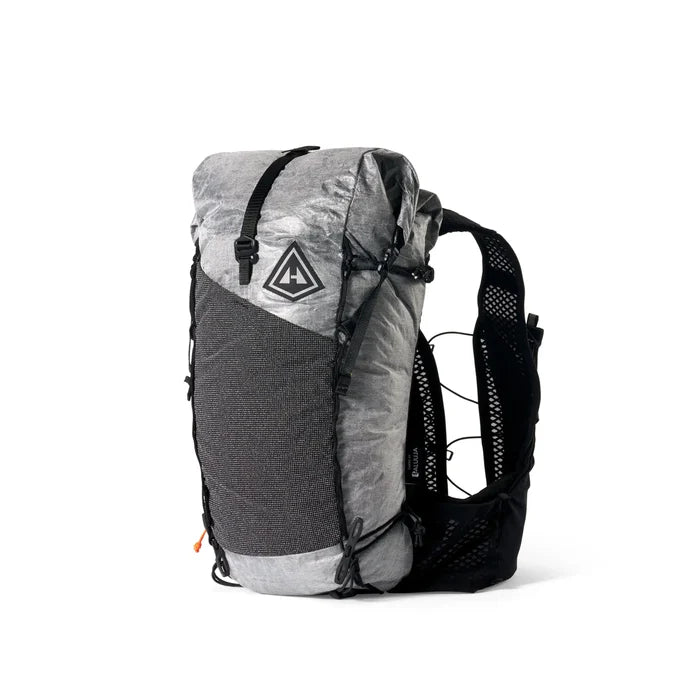 Hyperlite Mountain Gear Pemi 15 in grey Dyneema with vest harness – angled front studio view