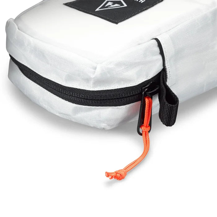 Hyperlite Mountain Gear Prism Crampon Bag open showing a pair of crampons inside