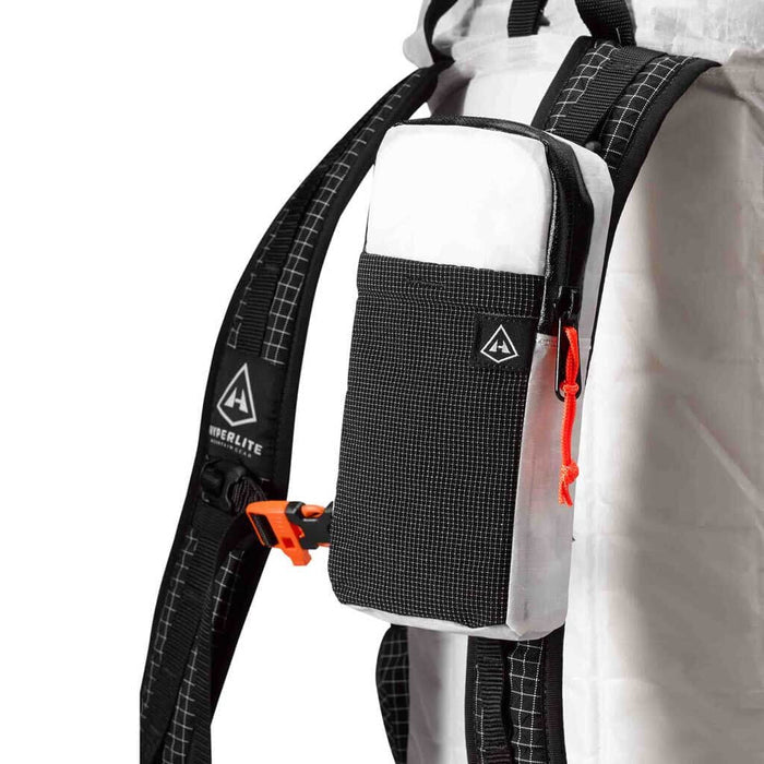 Hyperlite Mountain Gear Shoulder pocket mounted on a white pack's shoulder strap, orange buckle