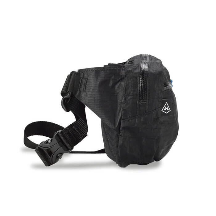 Hyperlite Mountain Gear Versa hip pack in black with blue zipper pulls, angled studio view