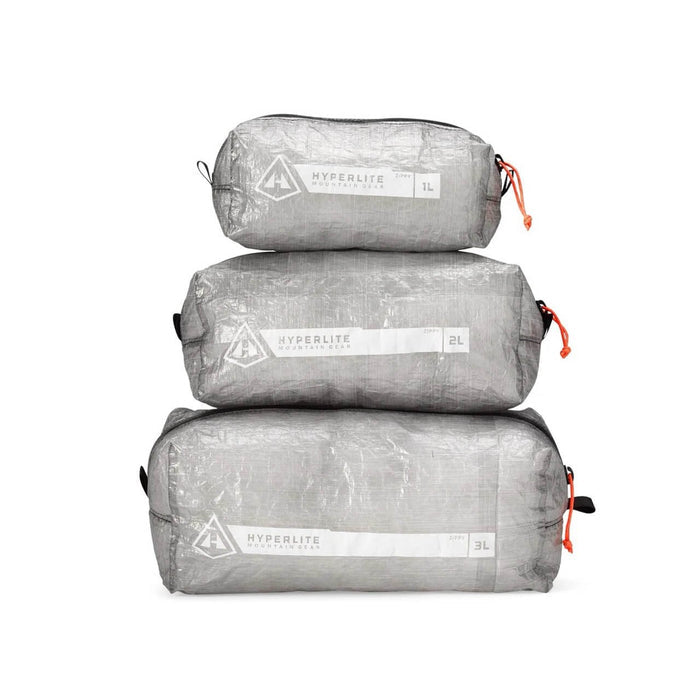Hyperlite Mountain Gear Zippy pouches in 1L, 2L, and 3L sizes stacked, front view