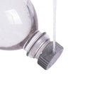 Igneous Bottle Cap Bidet – fitted on a squeezed bottle, spraying water