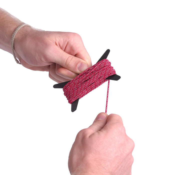 Igneous Carbon Fiber Spool – winding red cord onto the star-shaped spool
