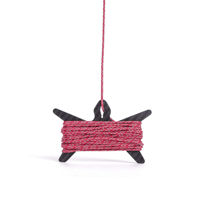 Igneous Carbon Fiber Spool – wound with red cord, hanging view