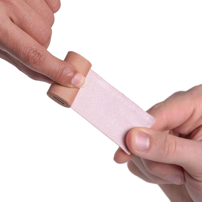 Igneous UL Leuko Tape Spool – holding a strip of tan tape