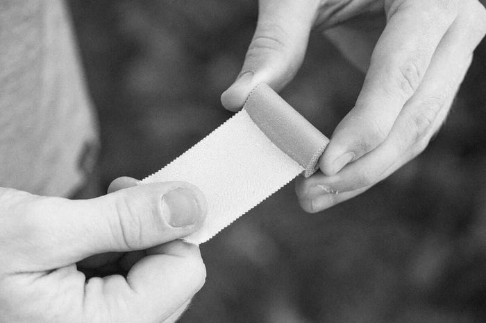 Igneous UL Leuko Tape Spool – tearing a length of tape by hand
