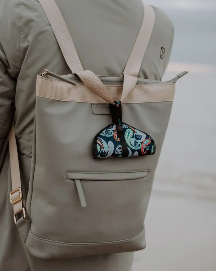 Läppie Pee Cloth in Fiesta print – clipped to a daypack