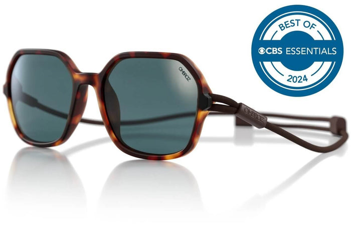 Ombraz Cammina armless sunglasses, tortoise frame with grey lenses – angled studio view with CBS Essentials 2024 badge