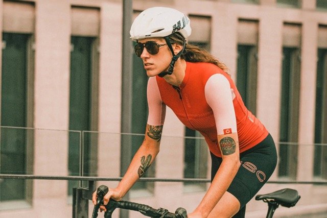 Ombraz Classic armless sunglasses worn by cyclist in the city – front view