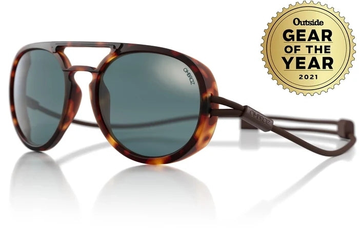 Ombraz Dolomite armless sunglasses, tortoise frame with grey lenses – angled studio view