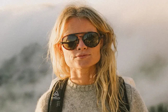 Ombraz Dolomite armless sunglasses with brown lenses worn outdoors – front view