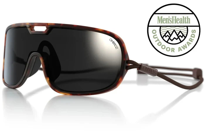 Ombraz Refugio armless sunglasses, tortoise frame with black-mirror lenses – angled studio view with Outdoor Awards badge
