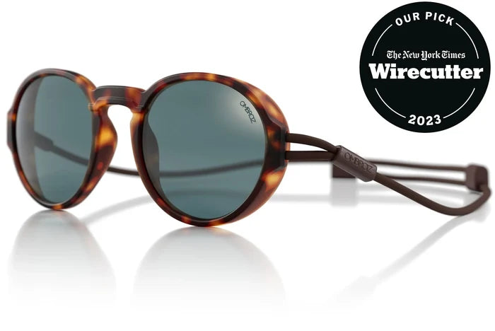 Ombraz Viale armless sunglasses, tortoise frame with grey lenses – angled studio view with Wirecutter 2023 badge