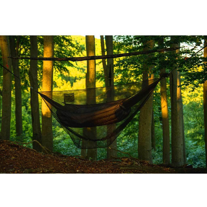 Outdoorline Hammock Mosquito Net – over a hammock in a green forest