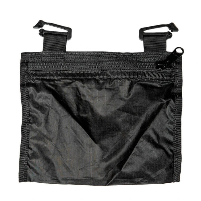 ULA Internal Stash Pocket laid flat, black zip pouch with two hook attachment straps at the top