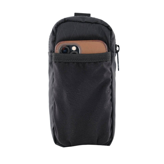 ULA Shoulder Strap Pocket with a phone tucked in, angled view with the top strap loop visible