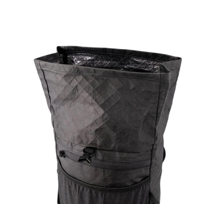 ULA Ultra Node – roll-top closure open showing the diamond-pattern fabric interior