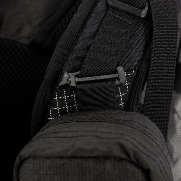 ULA ULTRA Shoulder Strap Pocket in black with mesh front, straight-on studio view