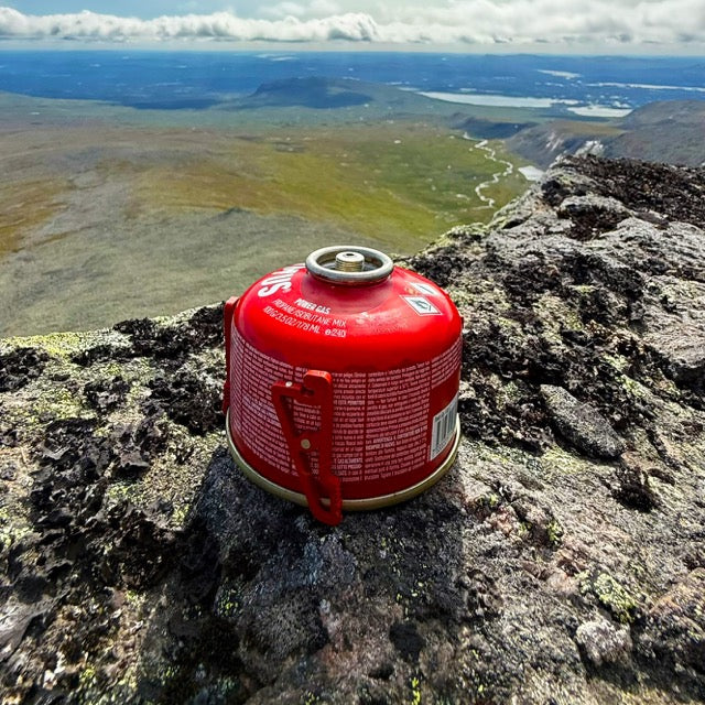 UltimaPeak MagFeets in orange – on a canister outdoors, side