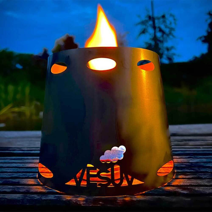 VESUV HOTSPOT 40 alcohol stove in use under a glowing windshield at dusk