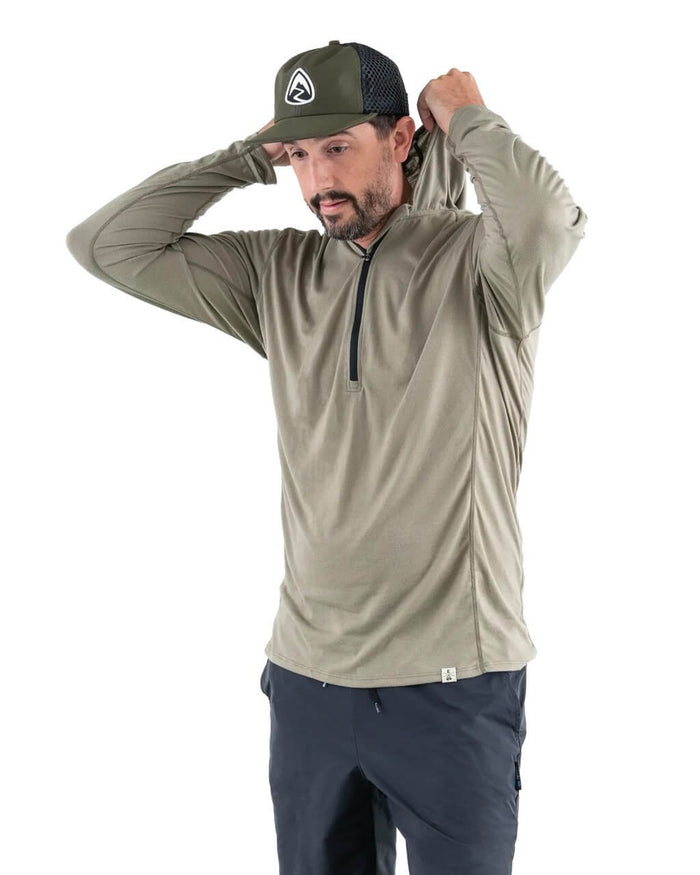 Zpacks Mirage Merino Sun Hoody in Light Olive worn, pulling up the hood