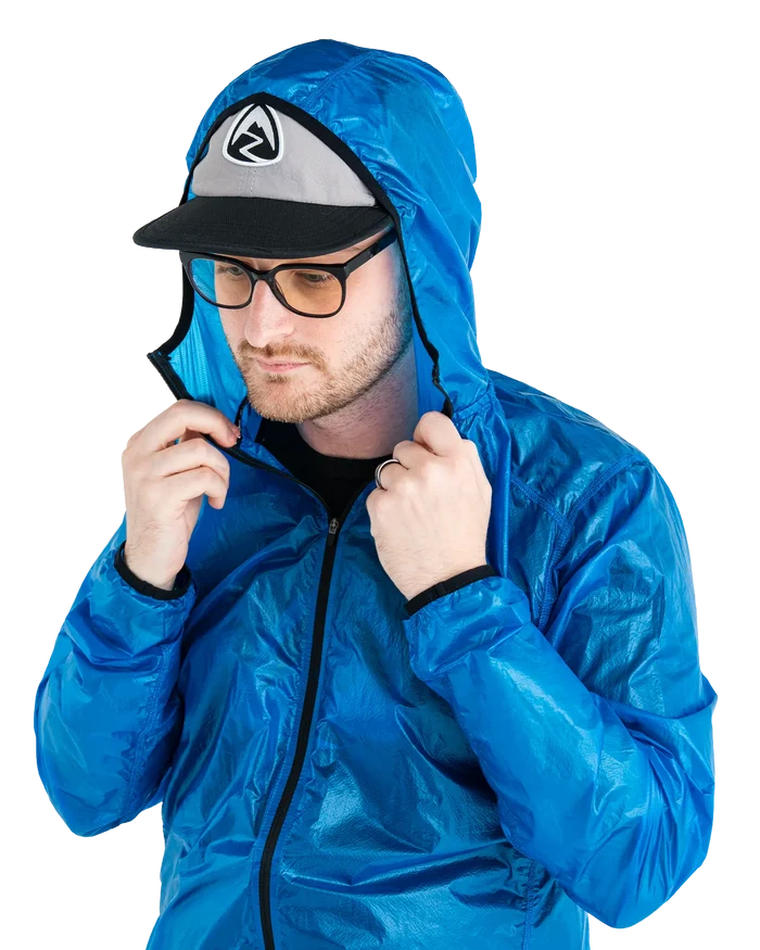 Zpacks Ventum Wind Shell Jacket in blue – worn with hood up over a cap