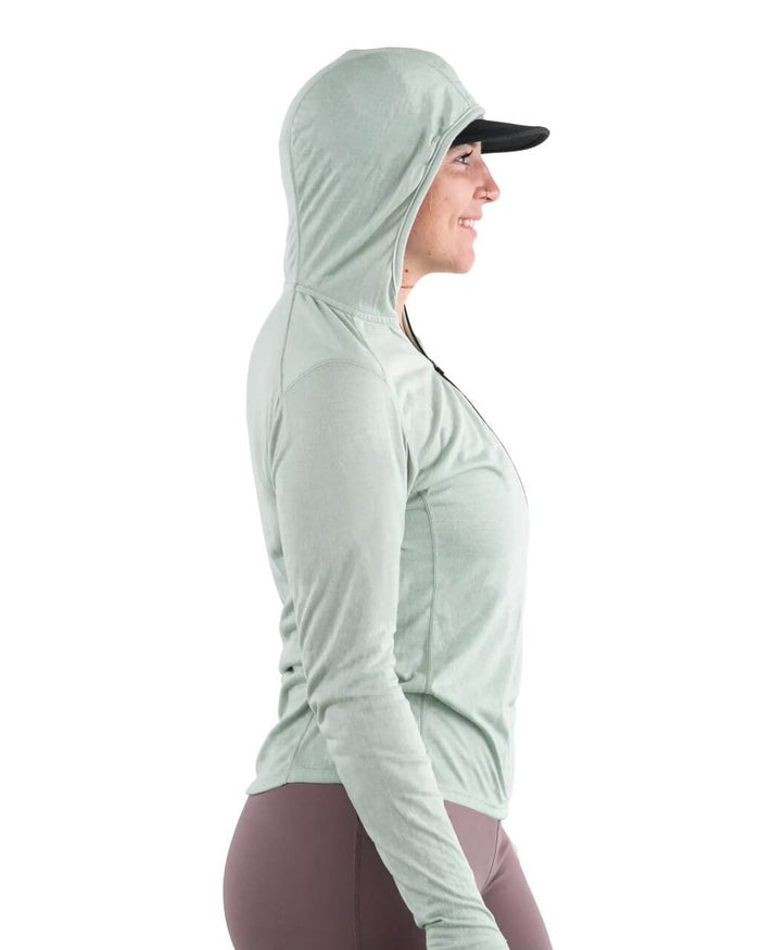 Zpacks Women's Mirage Merino Sun Hoody in Mint worn with hood up, side view