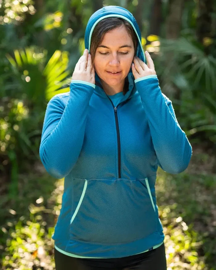 Zpacks Women’s Octa Fleece Hoody in blue – worn with hood up outdoors